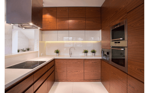 Fully custom white shaker kitchen cabinets with detailed crown molding, inset doors, quartz countertop, and premium hardware isolated on transparent background.